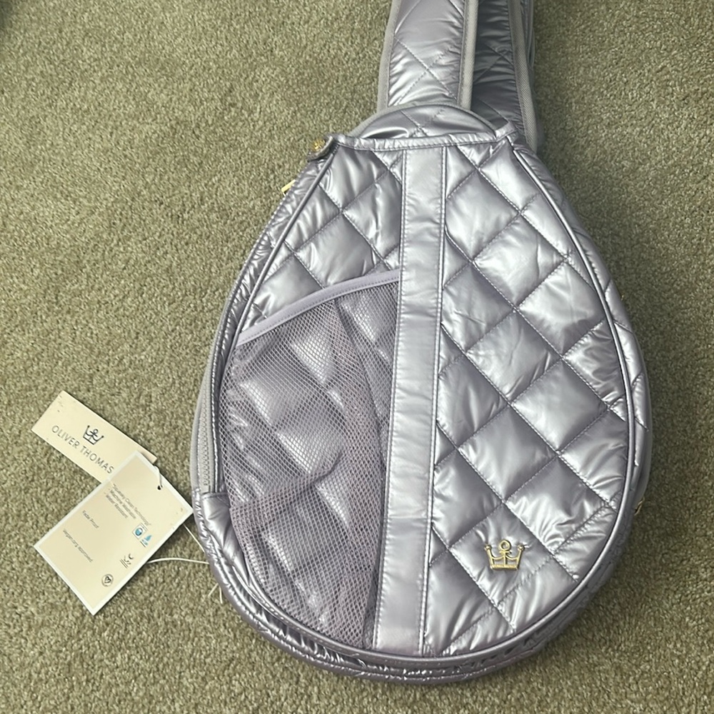 Oliver Thomas Purple crossbody Backpack Stylish and Functional.